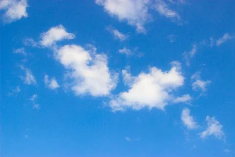 Clouds on a blue background Stock Photos