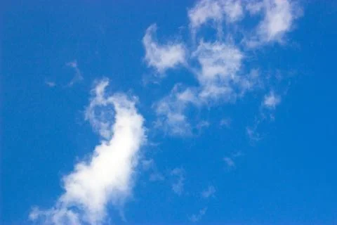 Clouds on a blue background Stock Photos