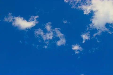 Clouds on a blue background Stock Photos