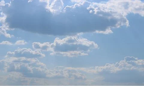 Clouds on a blue background with white clouds. Stock Photos