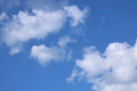 Clouds on a blue background with white clouds. Stock Photos
