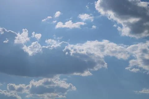 Clouds on a blue background with white clouds. Stock Photos