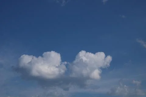 Clouds on a blue background with white clouds. Stock Photos