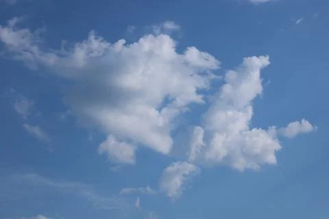 Clouds on a blue background with white clouds. Stock Photos