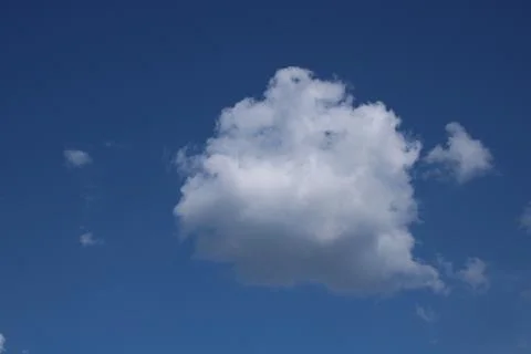 Clouds on a blue background with white clouds. Stock Photos