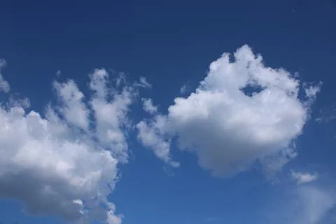Clouds on a blue background with white clouds. Stock Photos