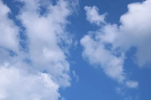 Clouds on a blue background with white clouds. Stock Photos