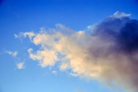 Clouds on a blue evening sky Stock Photos