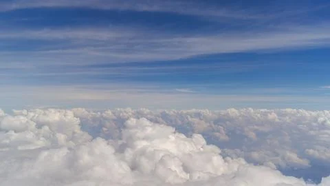 Clouds on a blue sky from an airplane Stock Photos