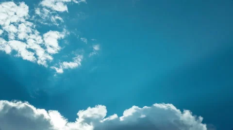 Clouds, blue sky and sun rays timelapse (4K) Stock Footage 41685329