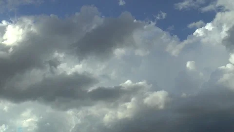 Clouds, blue sky and thunderstorm within a single minute, time lapse Stock Footage 93781195