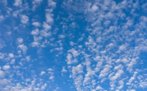 Clouds blue sky background cloudscape. Bright soft clouds white texture. Dayt Stock Photos