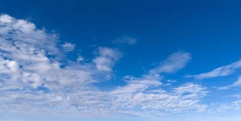 Clouds blue sky background texture. Bright soft clouds white pattern. Dayti.. Stock Photos