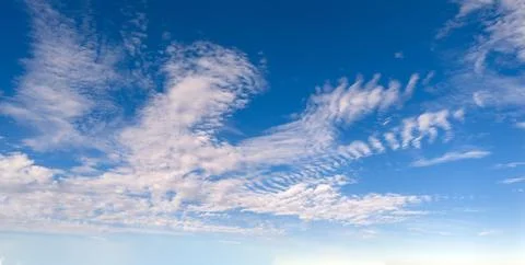 Clouds blue sky background texture. Bright soft clouds white pattern. Dayti.. Stockfoto's