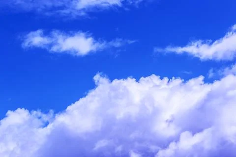 Clouds in the blue sky on a bright cloudy day Stock Photos