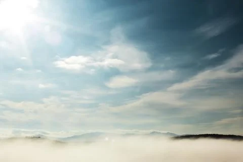 Clouds in the blue sky on a bright cloudy day Stock Photos