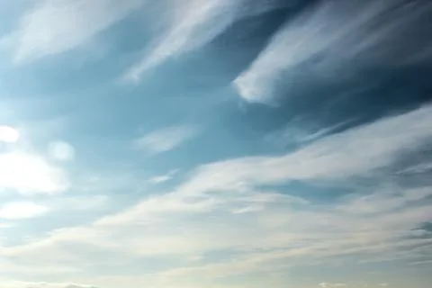 Clouds in the blue sky on a bright cloudy day Stock Photos