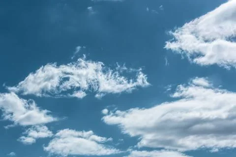 Clouds in the blue sky on a bright cloudy day Stock Photos