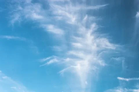 Clouds in the blue sky on a bright cloudy day Stock Photos