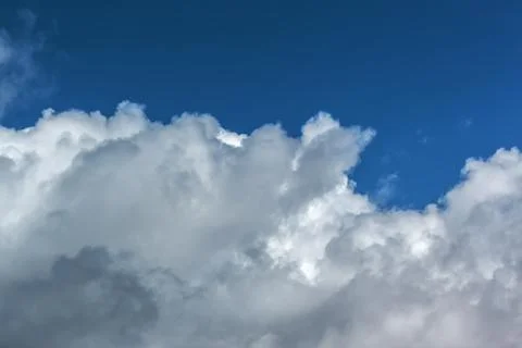 Clouds in the blue sky on a bright cloudy day Stock Photos