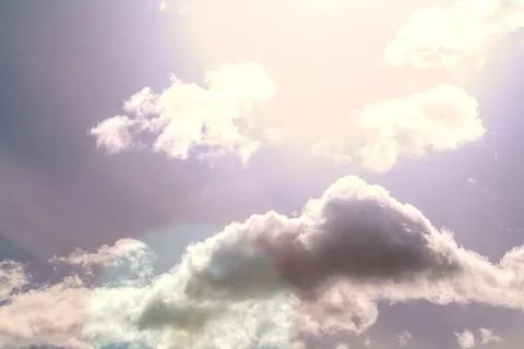Clouds in the blue sky on a bright cloudy day with sun shine Stock Photos