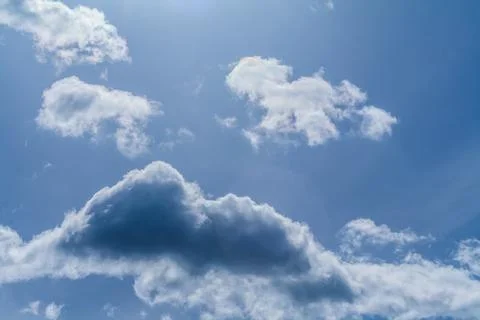 Clouds in the blue sky on a bright cloudy day Stock Photos