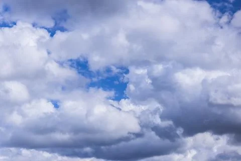 Clouds in the blue sky on a bright cloudy day Stock Photos