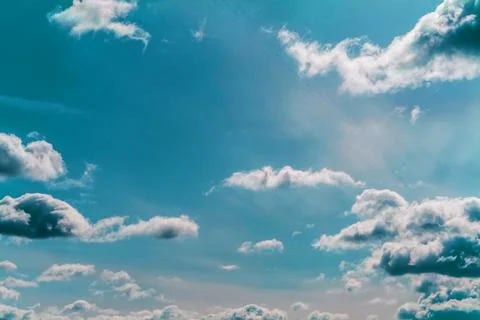 Clouds in the blue sky on a bright cloudy day Stock Photos