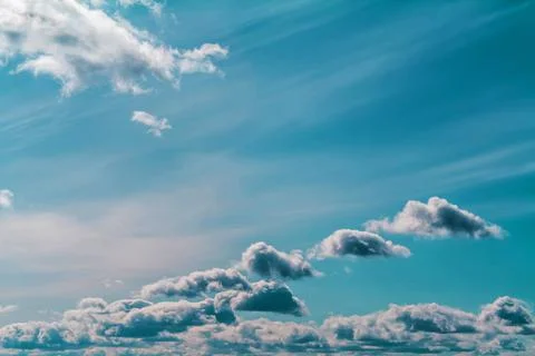 Clouds in the blue sky on a bright cloudy day Stock Photos
