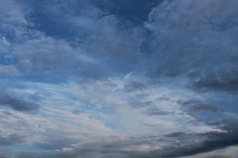 Clouds, blue sky, bright Sun Stock Photos