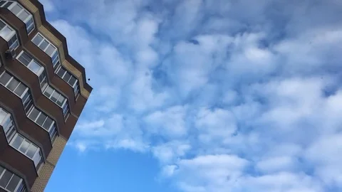 Clouds, blue sky, building. Time lapse Stock Footage 84165997