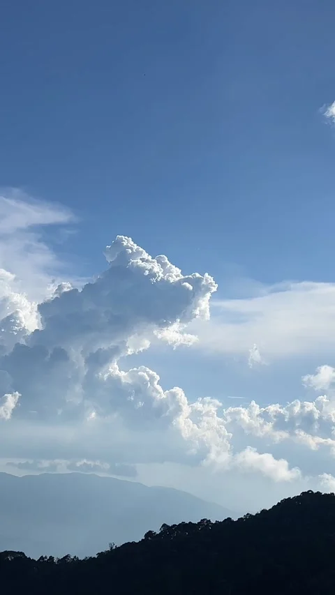 Clouds blue sky Green grassland and mountain natural landscape under the blue Stock Footage 322097516