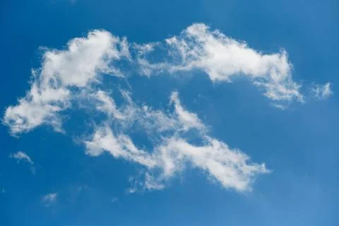 Clouds in the blue sky, light on the clouds in the sky Stock Photos