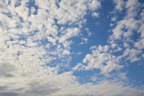 Clouds in the blue sky, light on the clouds in the sky Stock Photos