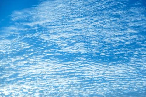 Clouds in the blue sky. Natural sky background texture, beautiful color. Peac Stock Photos