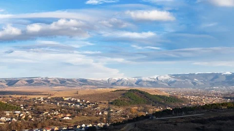 Clouds in blue sky over mountains, time lapse Stock Footage 122695333