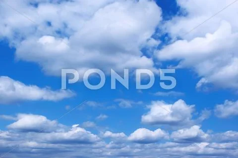 Clouds in a blue sky Stock Photos