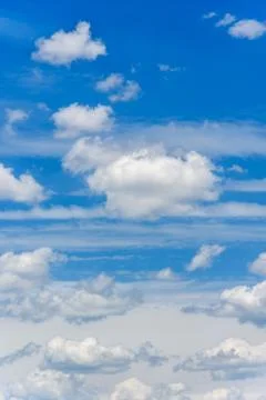 Clouds in a blue sky Stock Photos