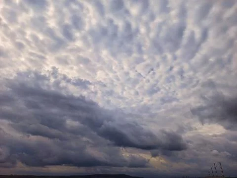 Clouds in the blue sky with place for text. Landscape Stock Photos