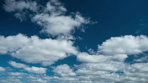 Clouds. Blue sky. Puffy fluffy clouds. Cumulus cloudscape timelapse. Stock Footage 206734097
