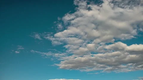 Clouds. Blue sky. Puffy fluffy clouds. Cumulus cloudscape timelapse. Stock Footage 206822489