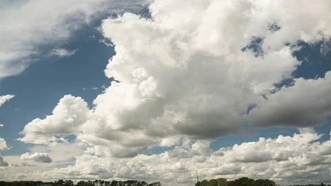 Clouds. Blue sky. Puffy fluffy clouds. Cumulus cloudscape timelapse. Stock Footage 209129220