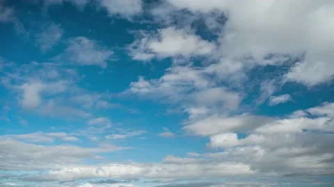 Clouds. Blue sky. Puffy fluffy Alto Cirrus Nimbo Clouds. Stock Footage 227329004