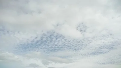 Clouds. Blue sky. Puffy fluffy Alto Cirrus Nimbo Clouds. Stockbeeldmateriaal 230066614