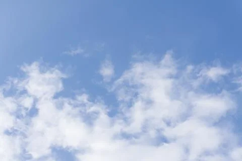 Clouds in the blue sky, sky background in pastel tone with copy space . Stock Photos