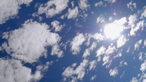 Clouds in blue sky with the sun Stock Footage 91222489