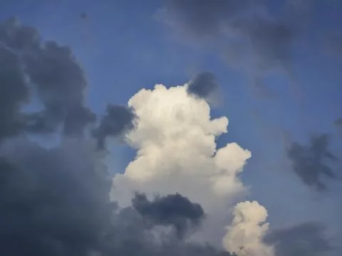 Clouds in the blue sky before a thunder-storm Stock Photos