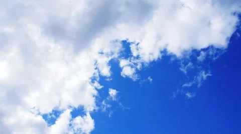 Clouds on Blue Sunny Sky Stock Photos
