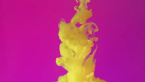 Clouds of bright yellow ink falling into liquid forming abstract patterns Stock Footage 275501153