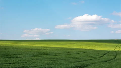 Clouds cast shadows on farmland Stock Footage 153274730
